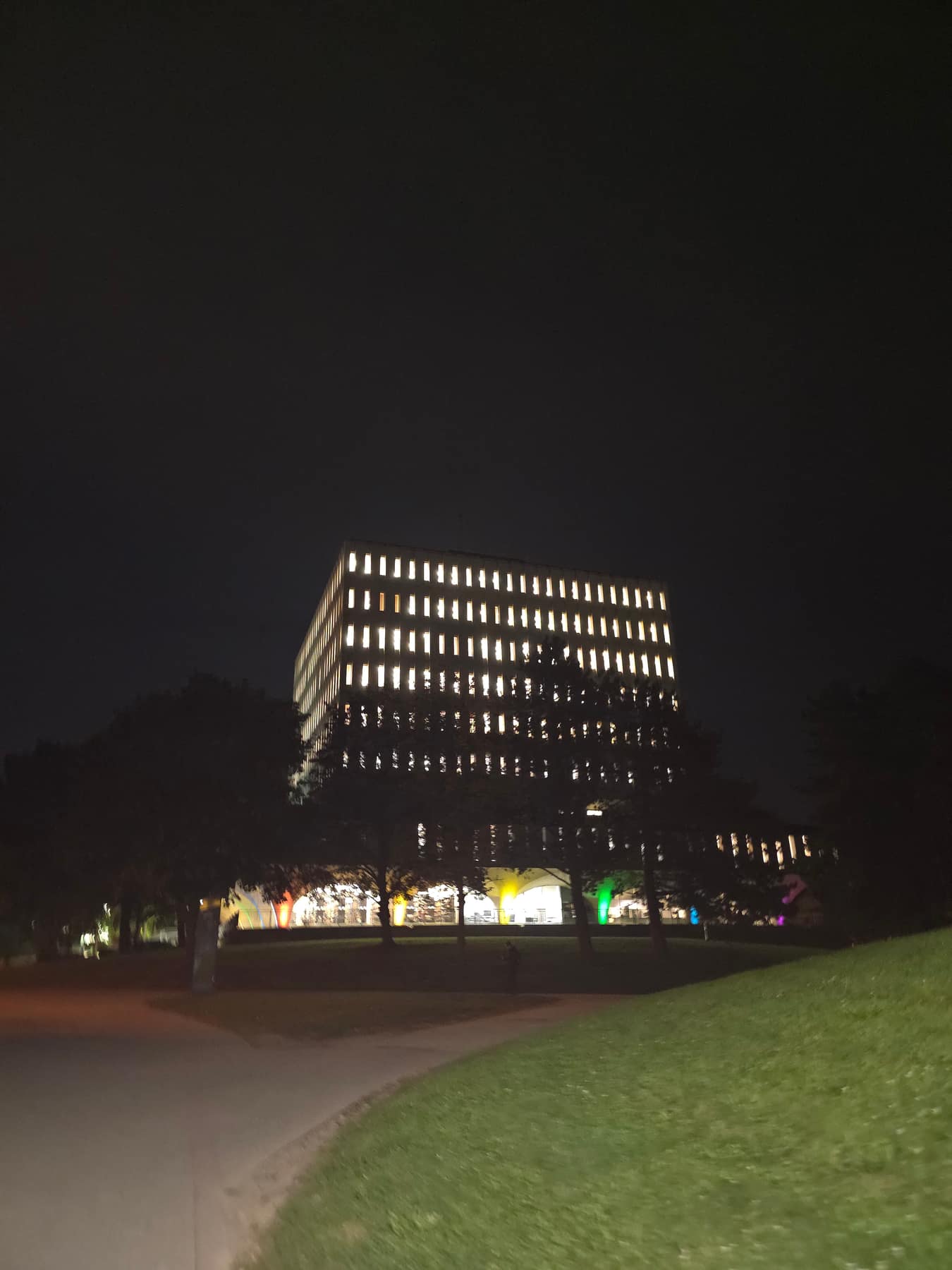 The Dana Porter Library at the University of Waterloo lit up against a dark night sky.